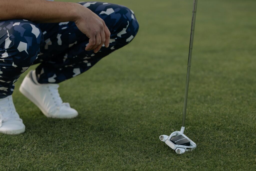 Close-up of a golfer's feet positioning for balance. — improve golf swing Dungeness