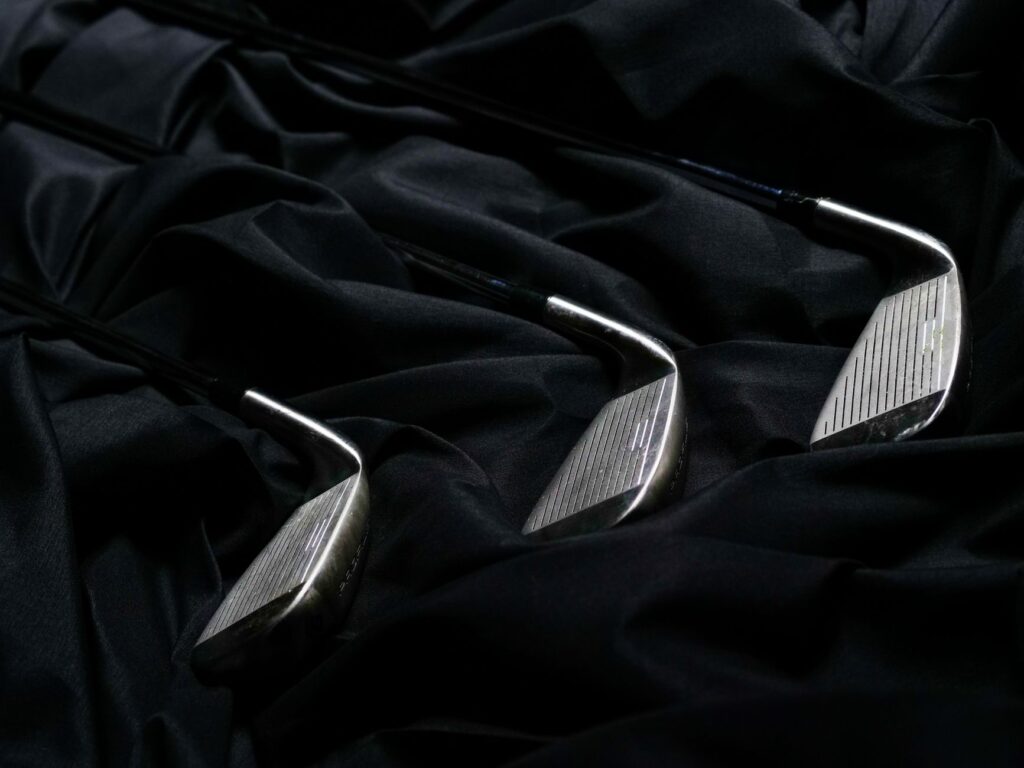 Close-up of specialized golf clubs designed for wet and windy conditions. — golf equipment Dungeness