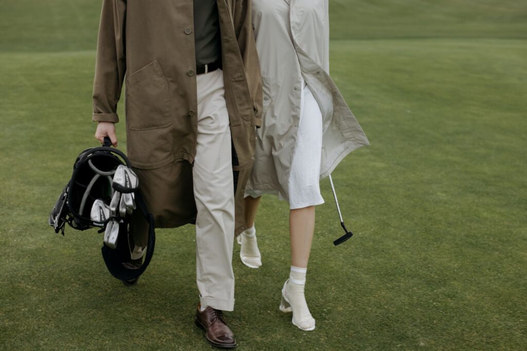 Different styles of golf footwear displayed together, showcasing the best golf shoes for various playing conditions.