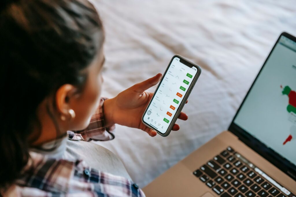 A golfer analyzing their swing using a mobile app or swing analyzer. — Dungeness Golf swing tips