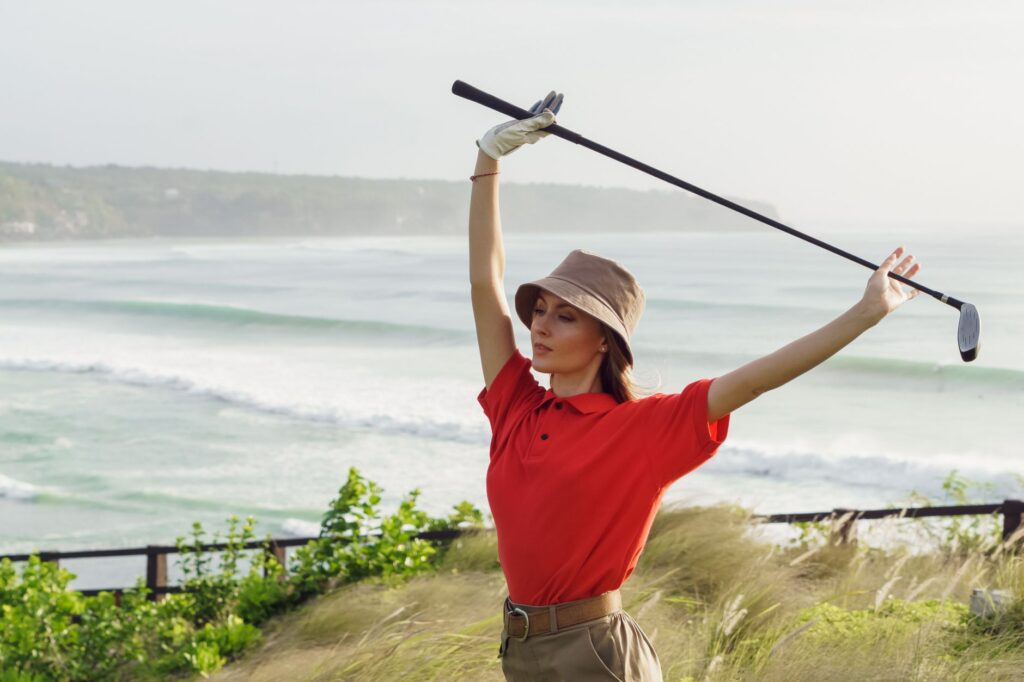 A golfer dressed in suitable attire for windy and coastal conditions. — golf equipment for Dungeness