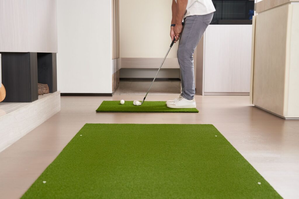 A golfer performing a distance control drill to avoid three putt