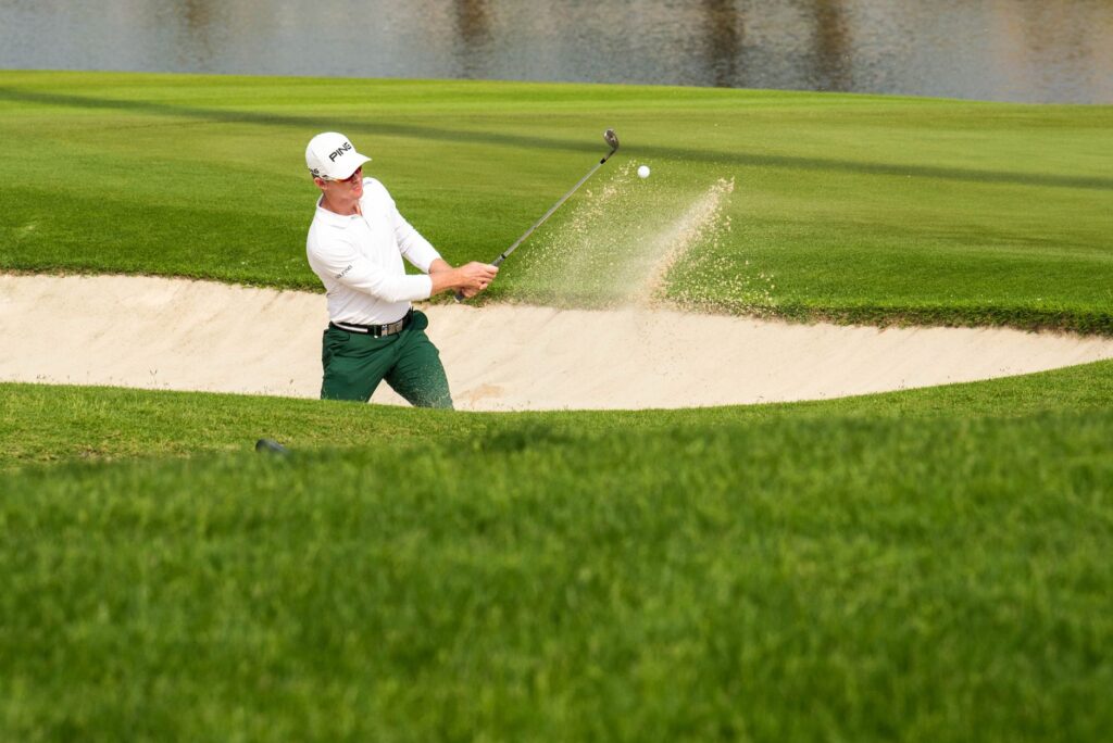 A golfer practicing swing techniques before the tournament. — Dungeness golf seasonal events
