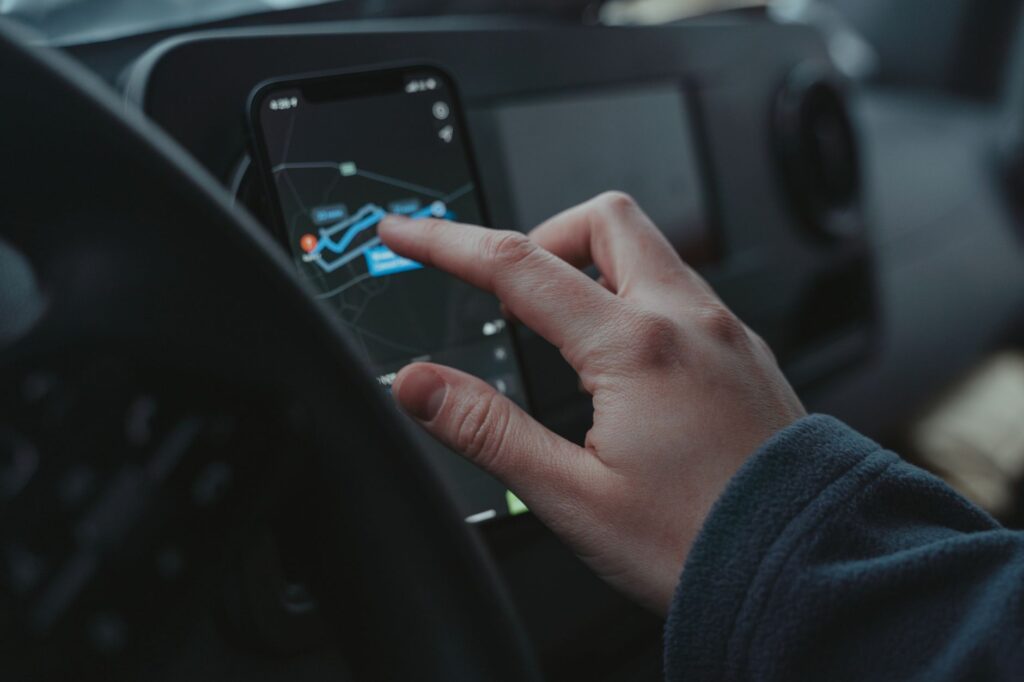 A golfer using a GPS device on the course. — golf gear Dungeness