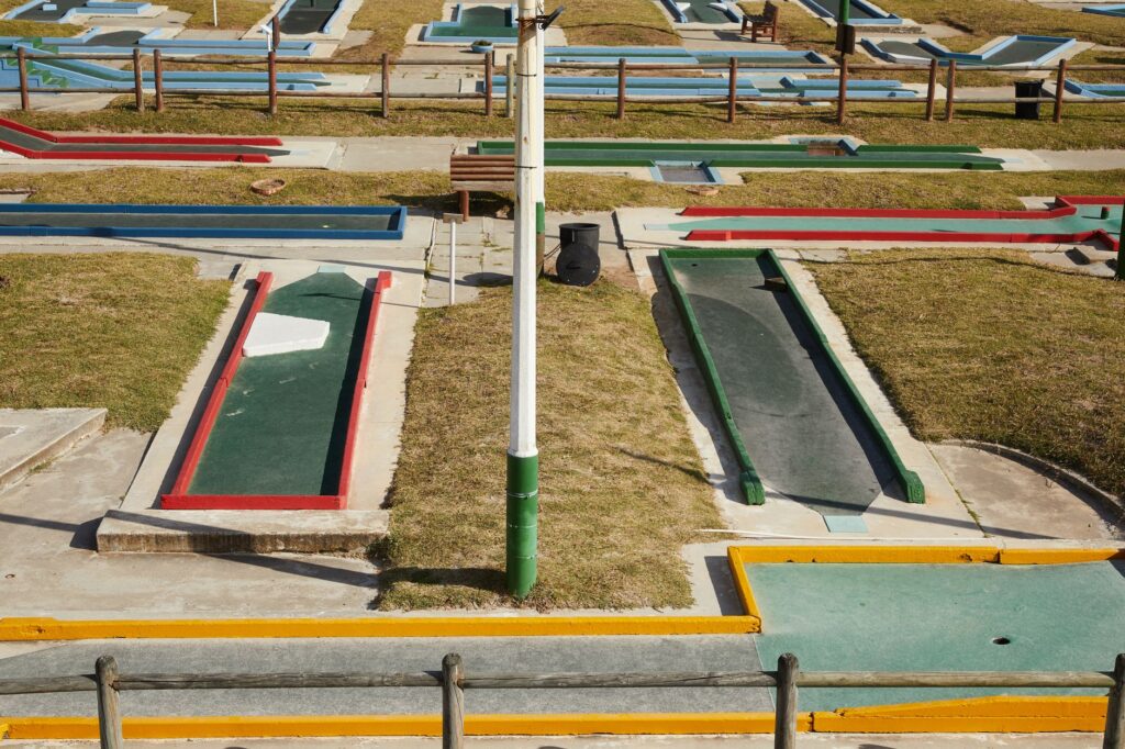 A scenic view of a mini-golf course in Dungeness, filled with vibrant colors and fun obstacles. — family golf activities…