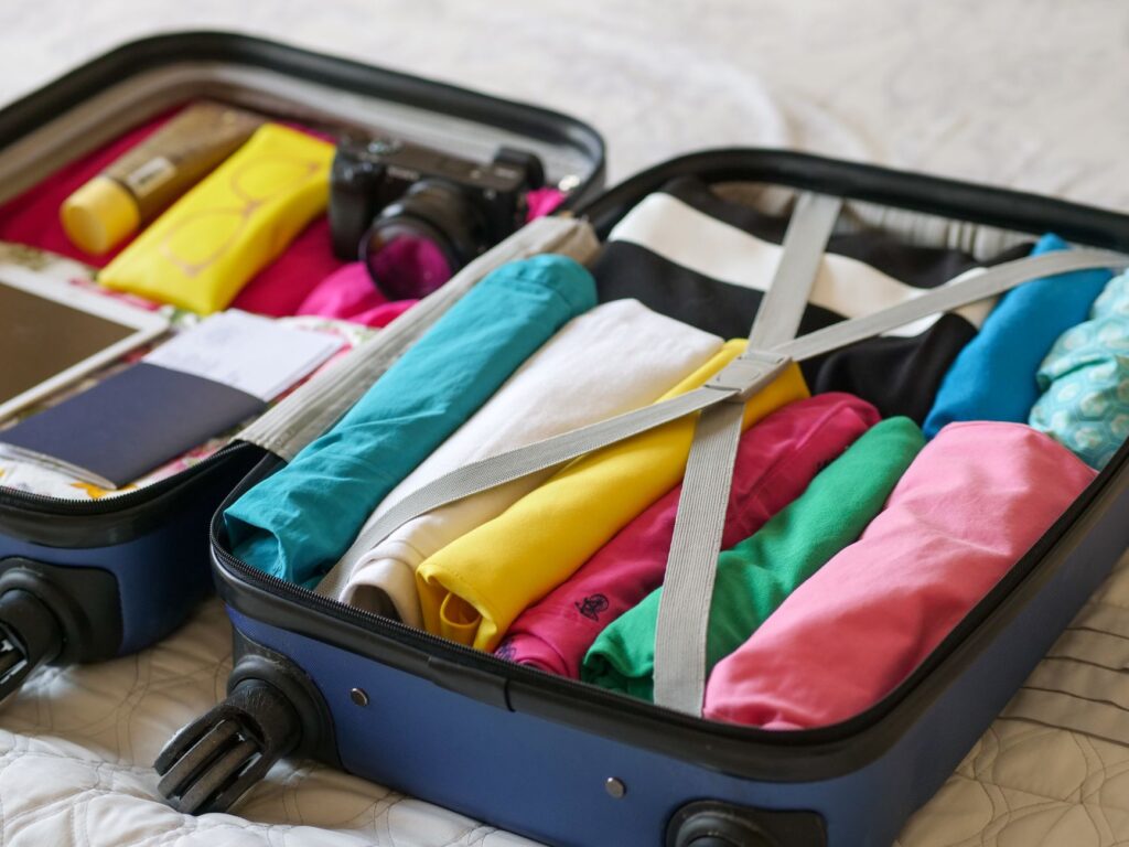 A well-organized packing list for a golf trip laid out on a table. — packing list for Dungeness golf trip
