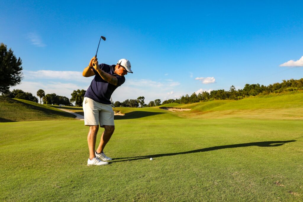 An action shot of a golfer applying strategy learned from a book — best golf books