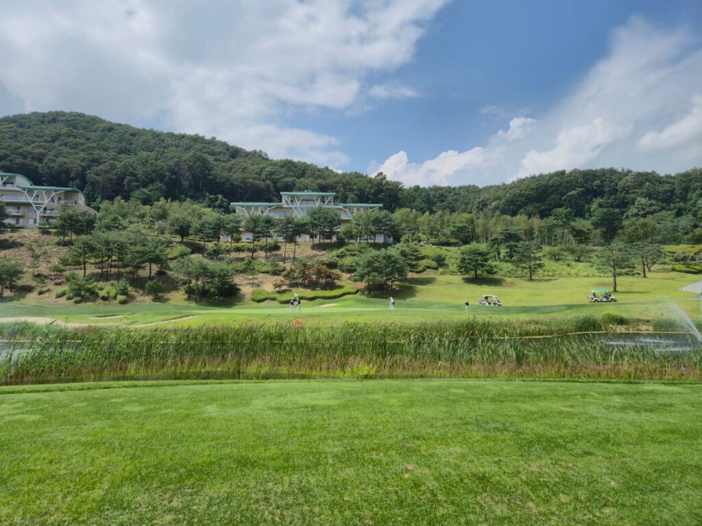 An eco-friendly golf course with sustainable technology visibly in use. — golf technology trends