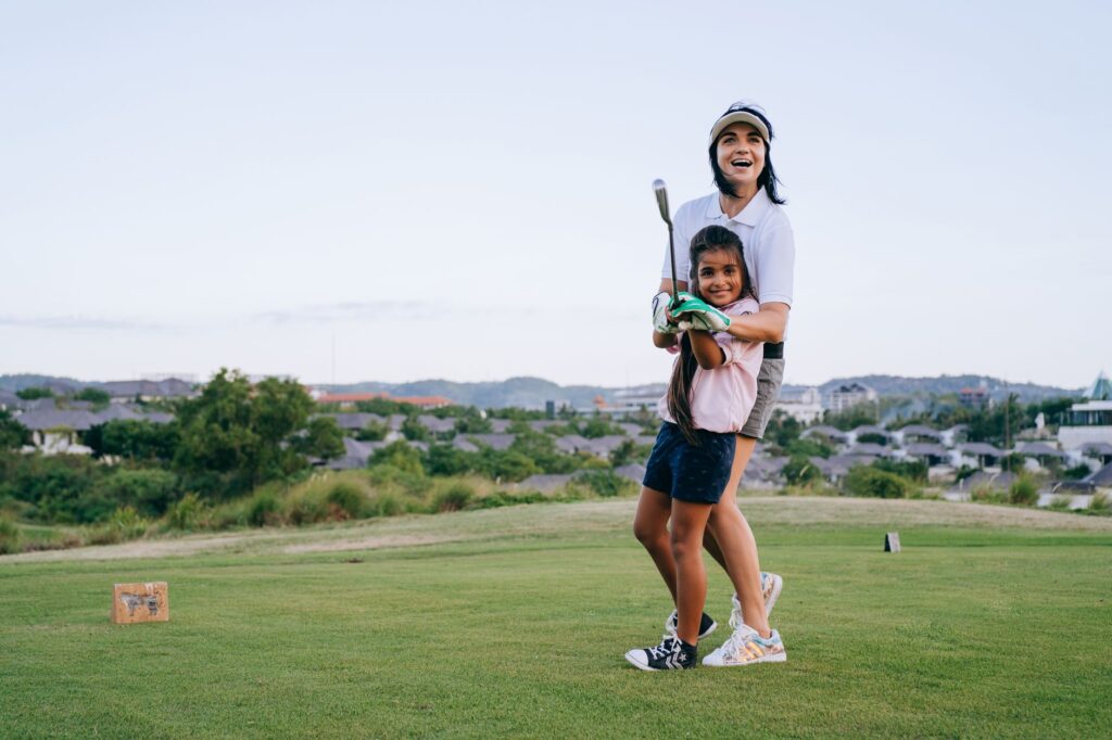 An engaging family golf tournament event with kids and parents participating in friendly competition. — family golf acti…