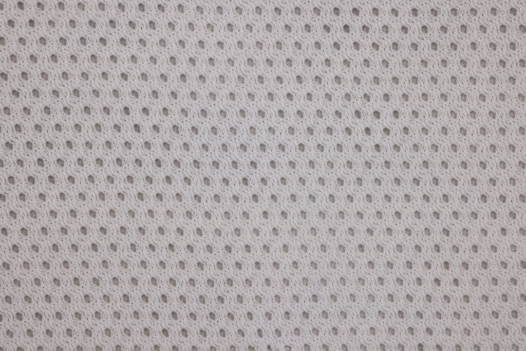 Close-up of breathable fabric used in performance golf clothing. — best golf apparel