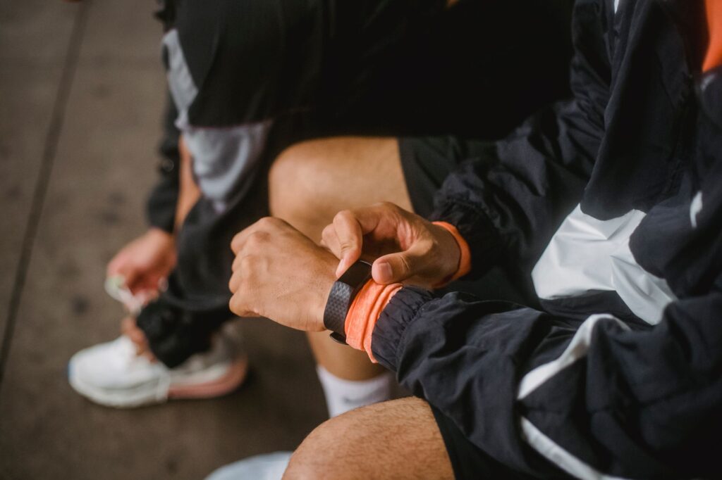 Different models of golf GPS watches on a table, showcasing the best golf GPS watch options