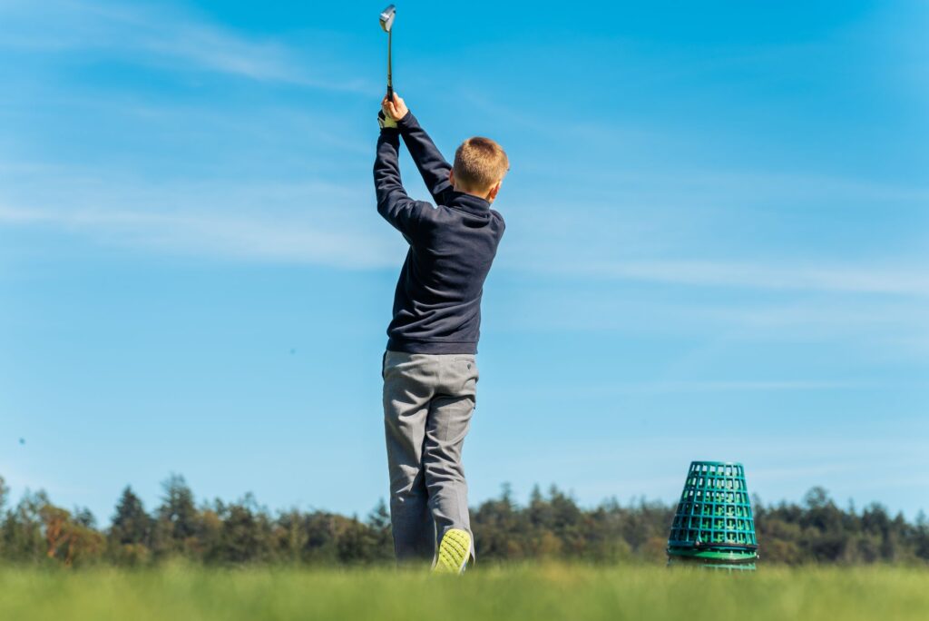 Image of a golfer practicing swings with fitted clubs in Dungeness. — choose golf club Dungeness