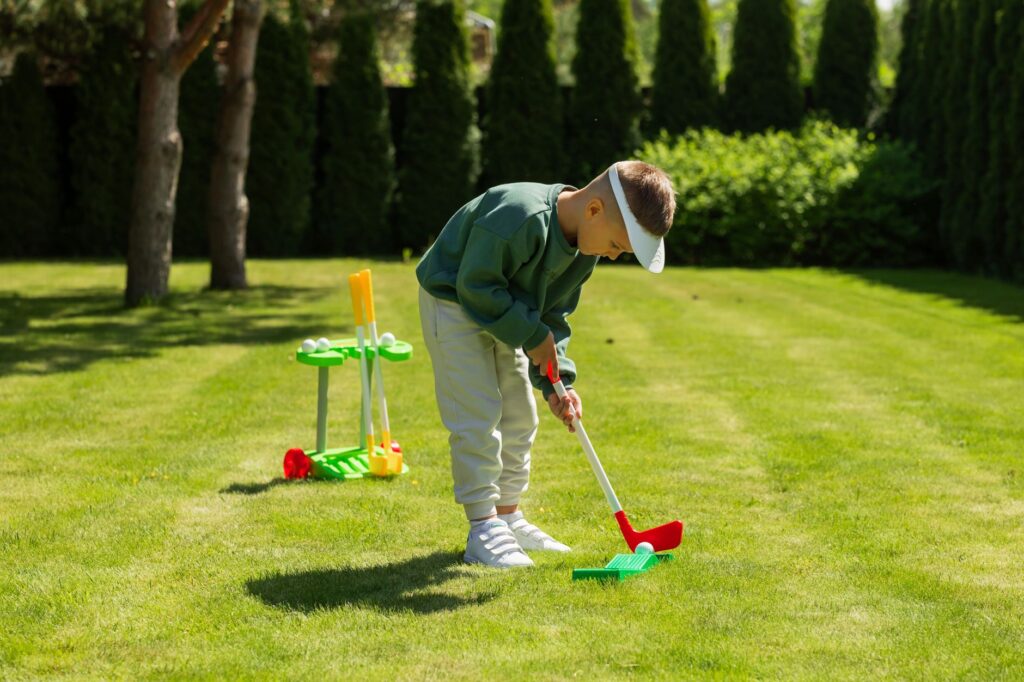 Kids playing mini-golf at Dungeness, highlighting fun family moments. — Dungeness Golf family activities