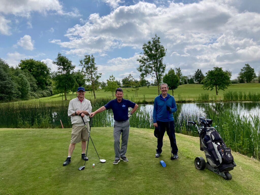 Players discussing strategies on the tee box at one of the top Dungeness golf courses. — best golf courses Dungeness