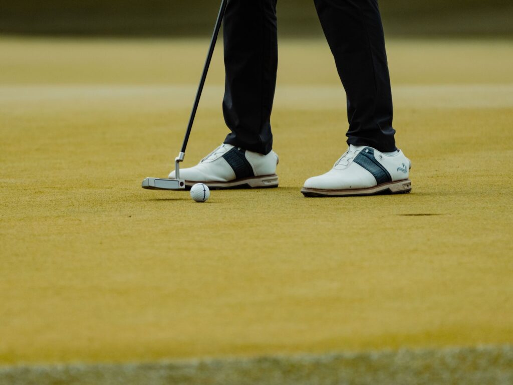 A close-up of a golfer taking a swing at the Dungeness Amateur Championship, showcasing the spirit of Dungeness golf tournaments 2026.