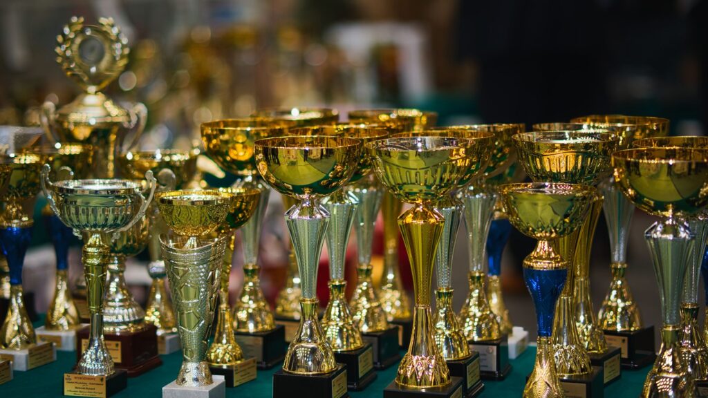 A close-up of trophies and awards for 2026 golf tournaments. — Dungeness golf tournaments 2026