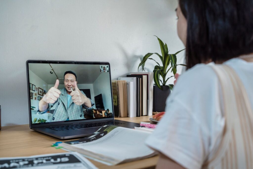A coach providing feedback during an online golf lesson. — golf training programs