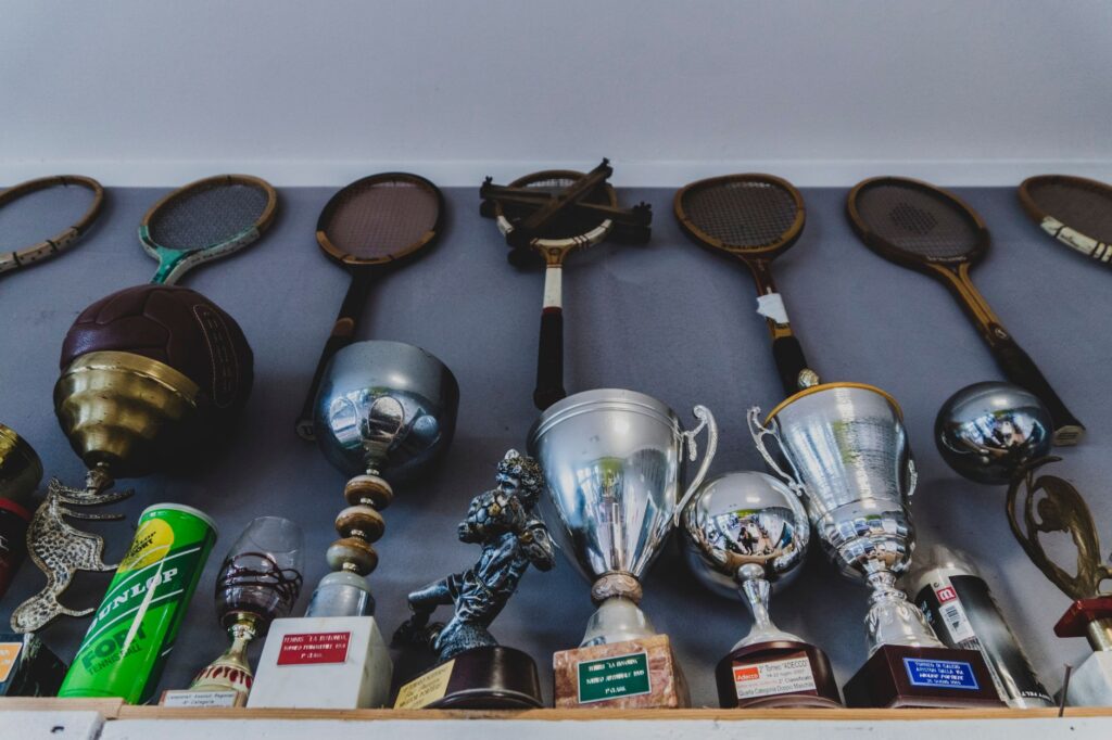 A collage of golf memorabilia from Dungeness, including old scorecards, trophies, and photographs. — history of golf Dun…