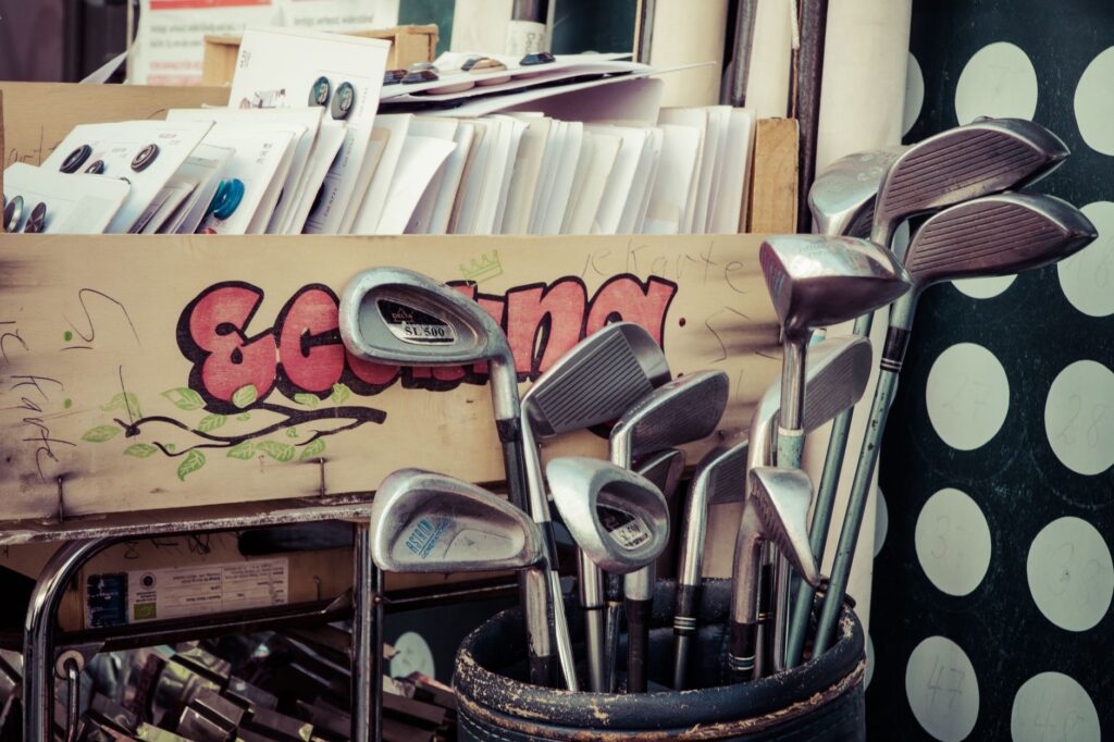 A display of affordable golf equipment available at a local shop, including the best golf clubs for Dungeness courses.