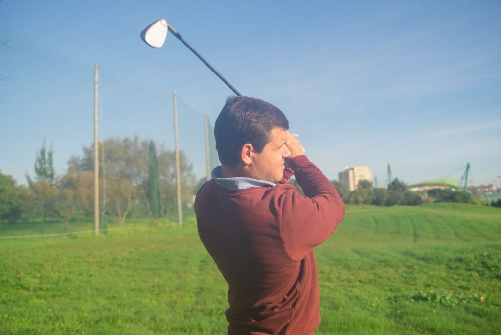 A golfer bundled up, playing on a chilly winter day in Dungeness — Dungeness golfing tips