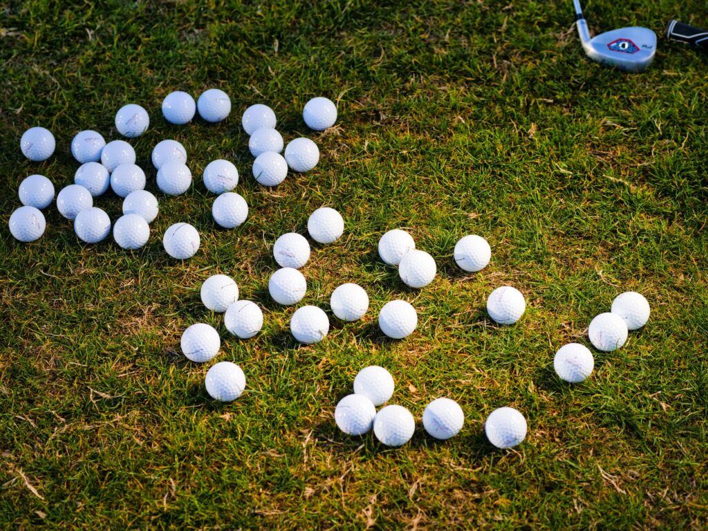 A golfer performing a pre-round routine at the driving range. — golf pressure tips