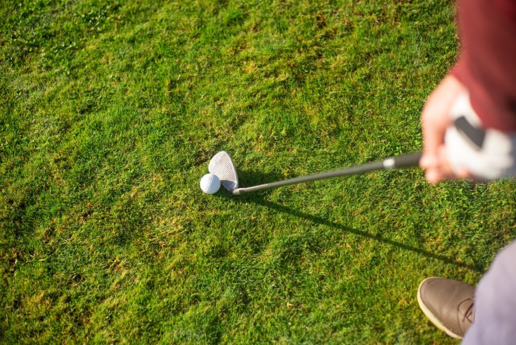 A golfer preparing to tee off on a tight fairway, illustrating the challenge of accuracy. — tight fairway golf