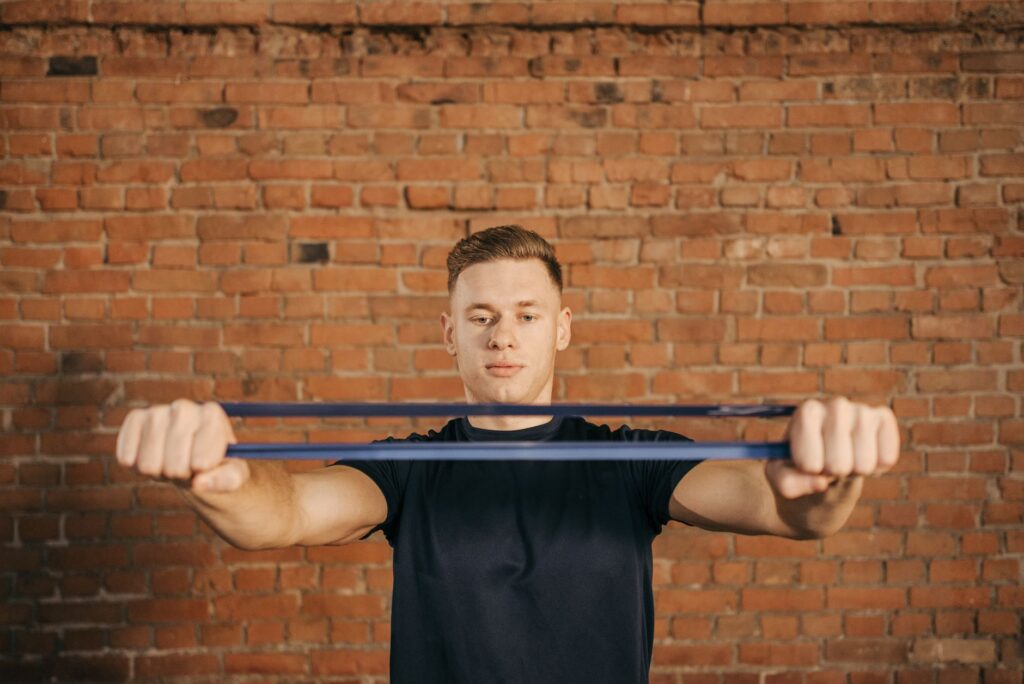 A golfer using resistance bands to improve swing strength. — golf swing power