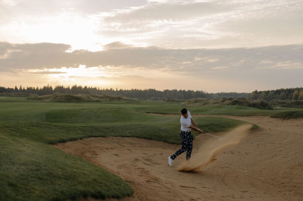 A golfer visualizing their shot before executing a bunker shot — bunker shot tips