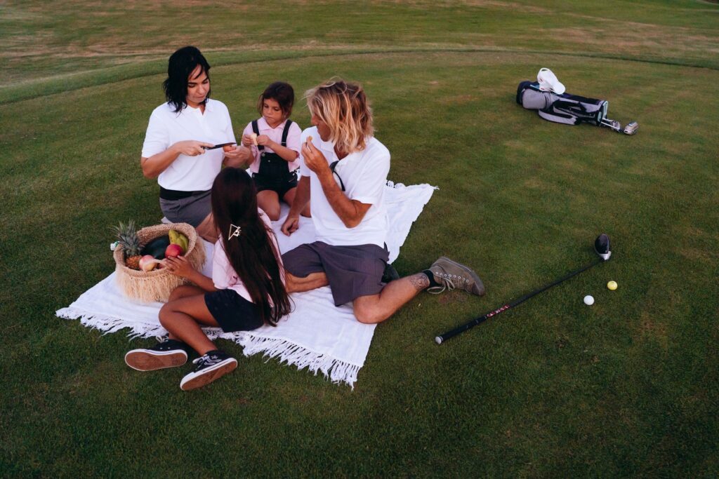 A group of friends enjoying a round of golf in the stunning Dungeness weather. — best golf courses Dungeness