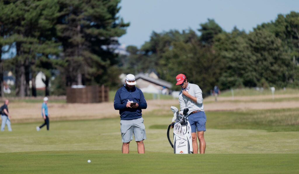A group of golfers discussing strategy during a sunny day — weather effects on Dungeness golf