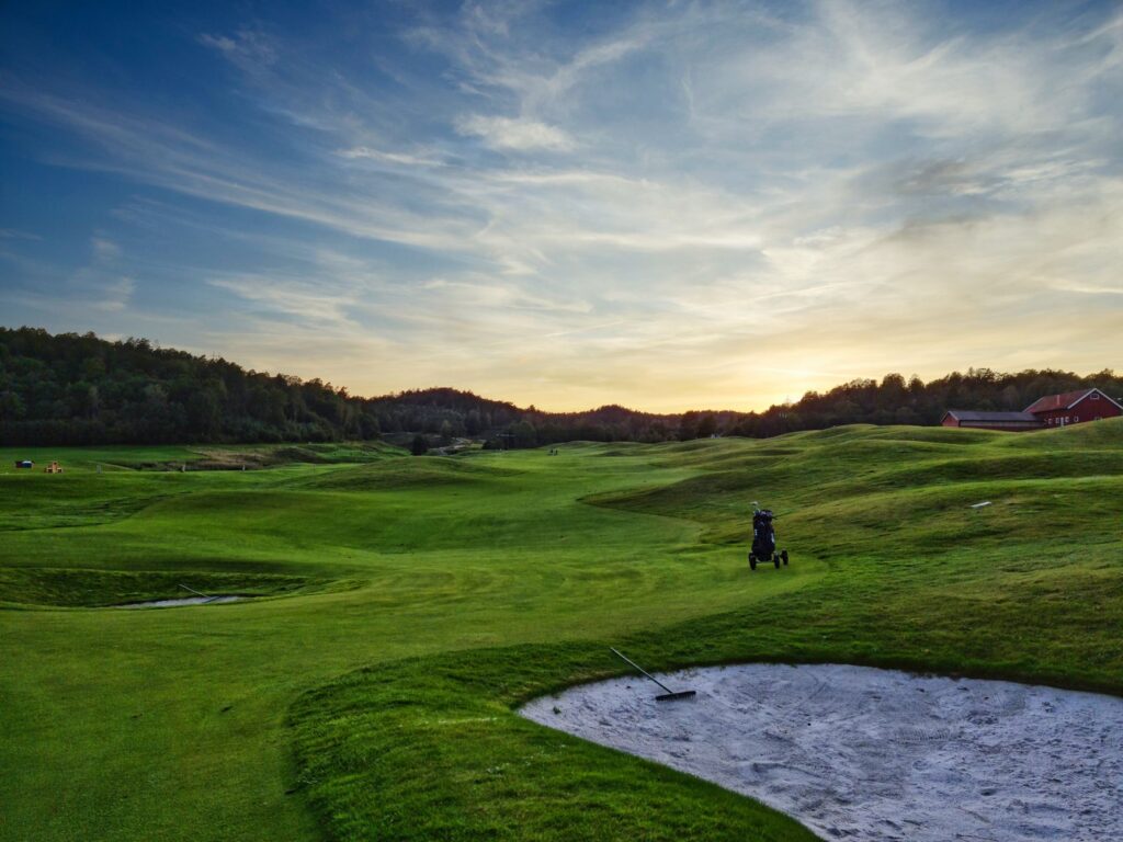 A panoramic view of the Dungeness Golf Club at sunset. — best golf courses Dungeness