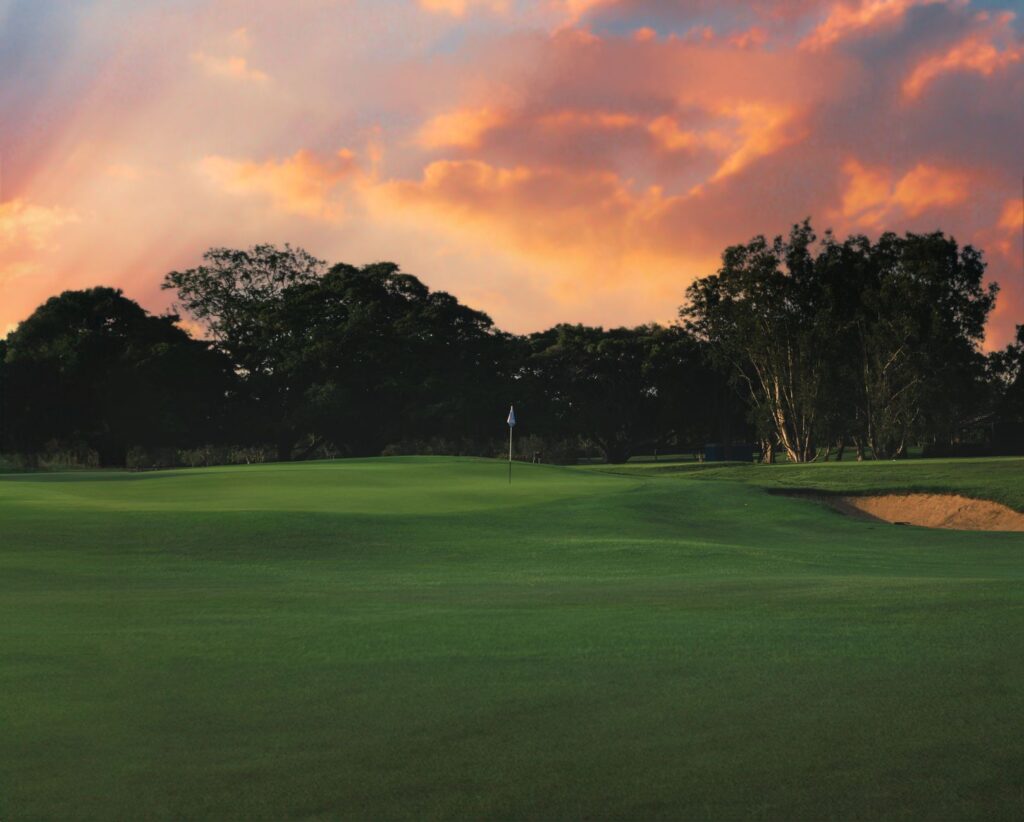 A picturesque view of one of the Dungeness golf courses at sunset