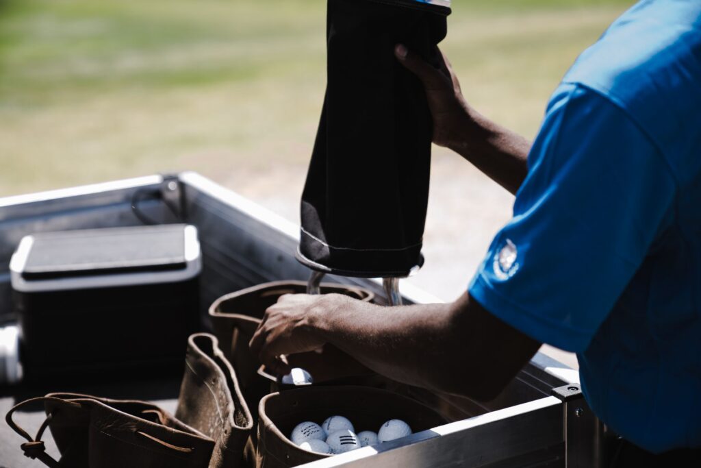 A well-organized golf bag filled with essential golf gear Dungeness, including clubs and balls.