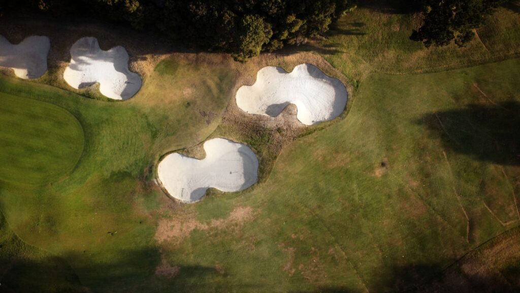 Aerial view of Dungeness Golf Club showcasing its lush fairways and greens. — Dungeness Golf Club history