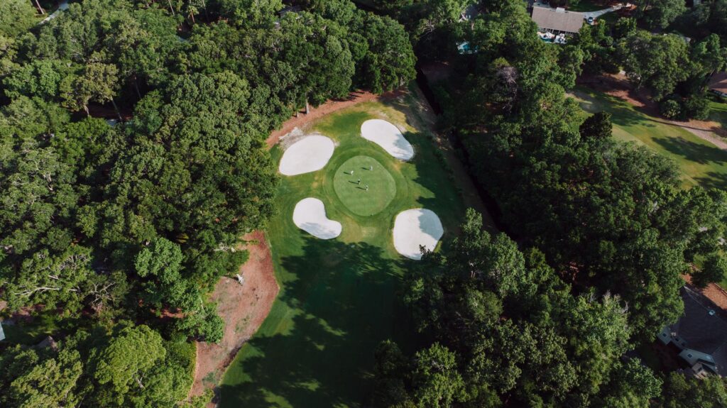 An aerial shot of a golfer navigating a challenging Dungeness hole — golf strategies Dungeness