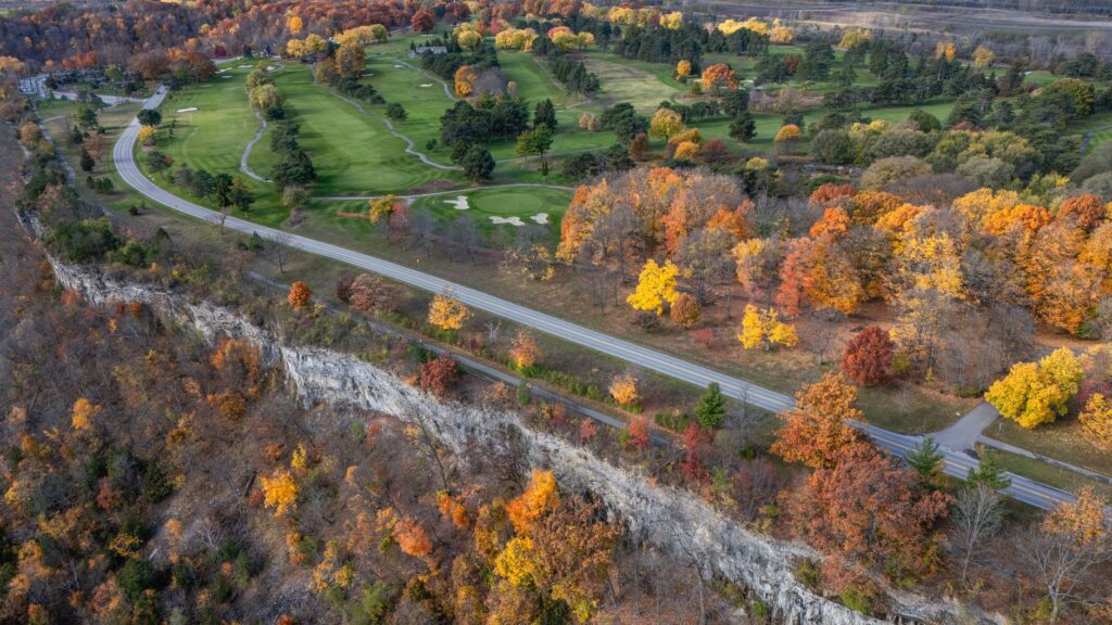 An aerial shot of the Dungeness golf course in autumn, highlighting the colorful fall foliage. — best time to play golf …