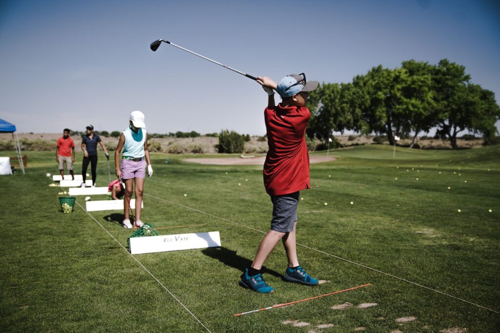 Children practicing their swings at a kid-friendly golf course in Dungeness. — family golf Dungeness