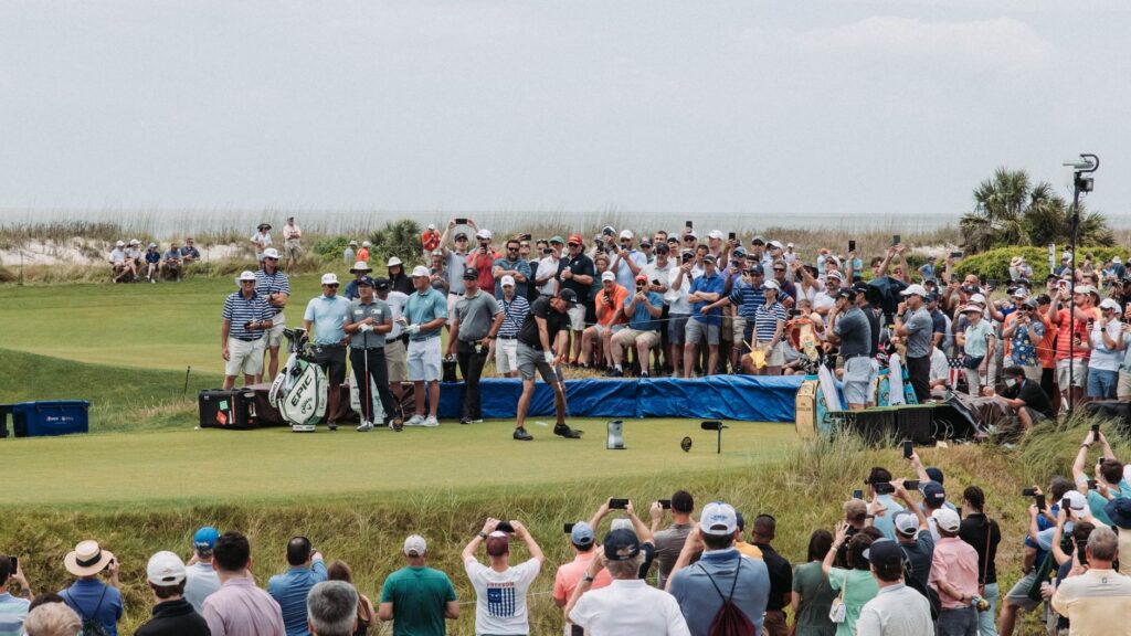 Fans cheering at a Dungeness golf event, showcasing community spirit. — Dungeness Golf tournaments 2026