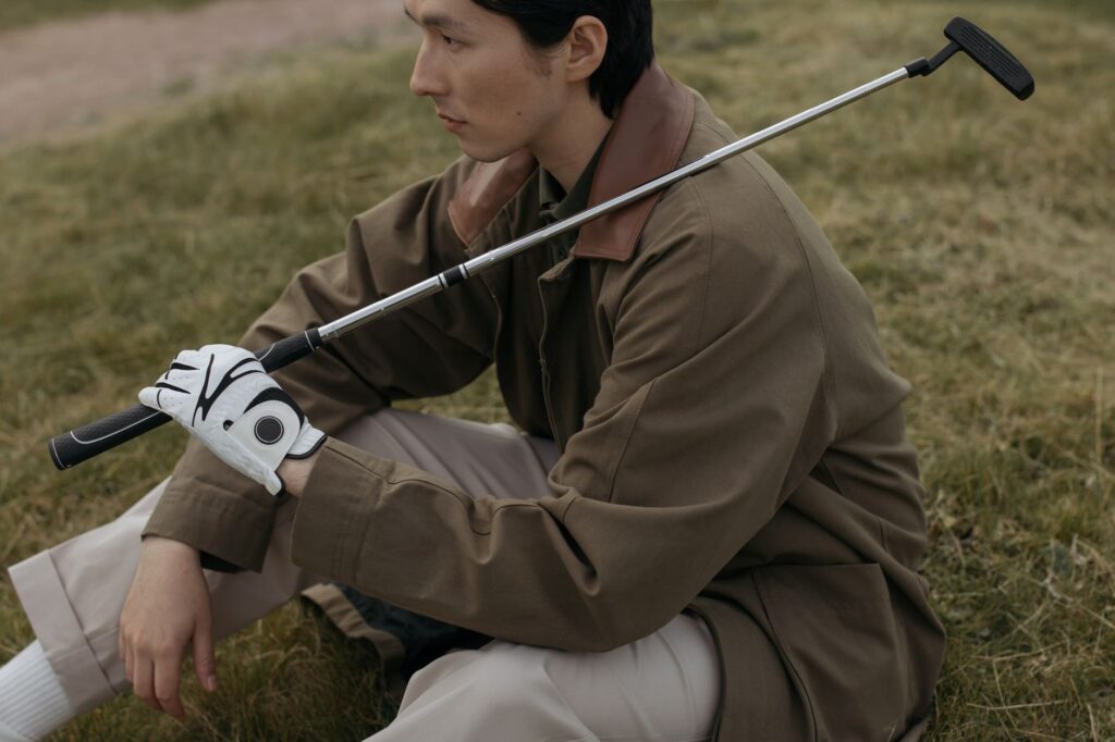 A golfer waiting patiently for their turn at the tee. — Dungeness golf etiquette