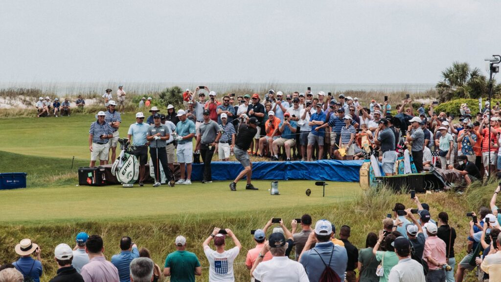 A local golf tournament in action, with spectators and players — Dungeness golf local guide