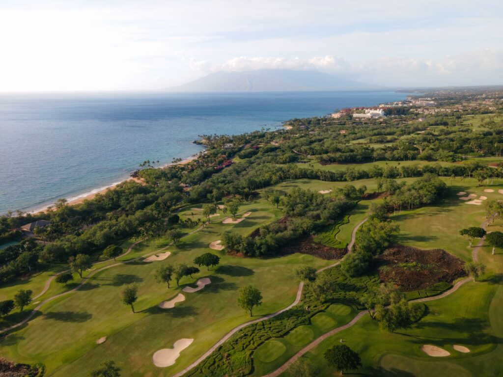 An aerial view of the coastline with golf courses integrated into the landscape — golfing Dungeness local guide