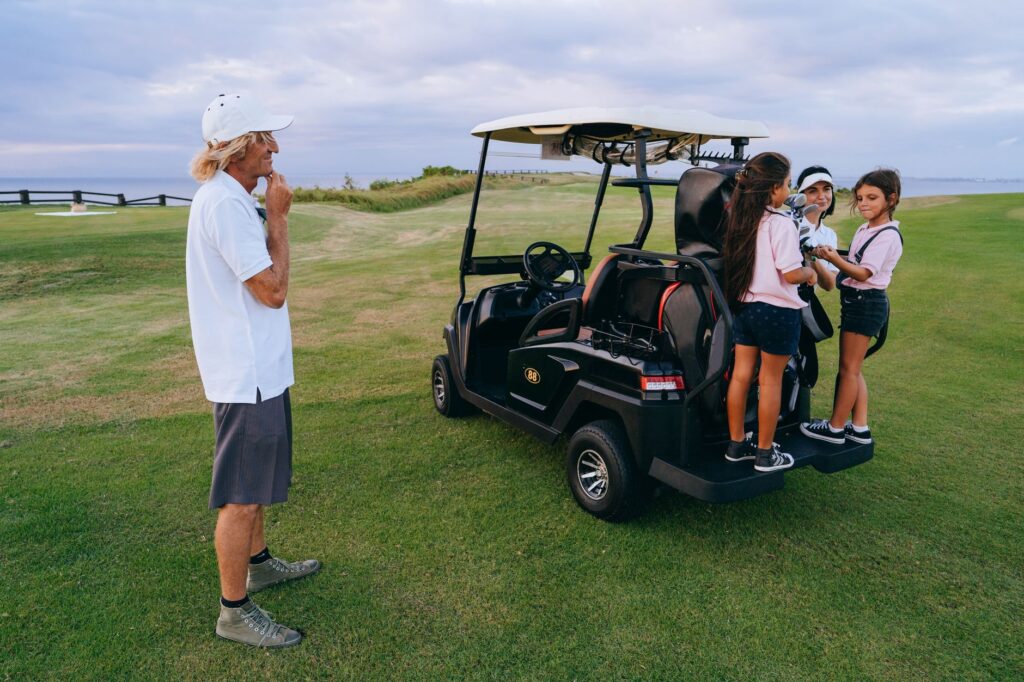 An instructor giving a golf lesson to kids in Dungeness. — family golf Dungeness